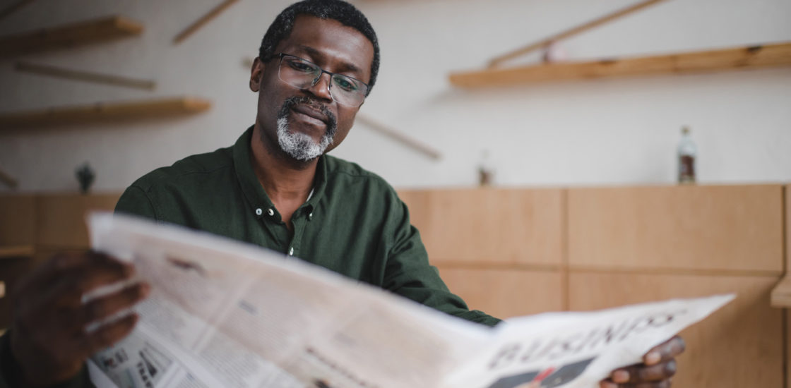 Man reading newspaper