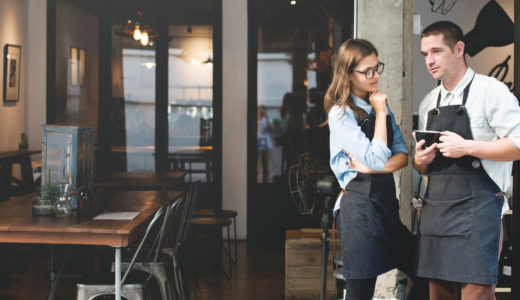 Restaurant workers discussing their employer